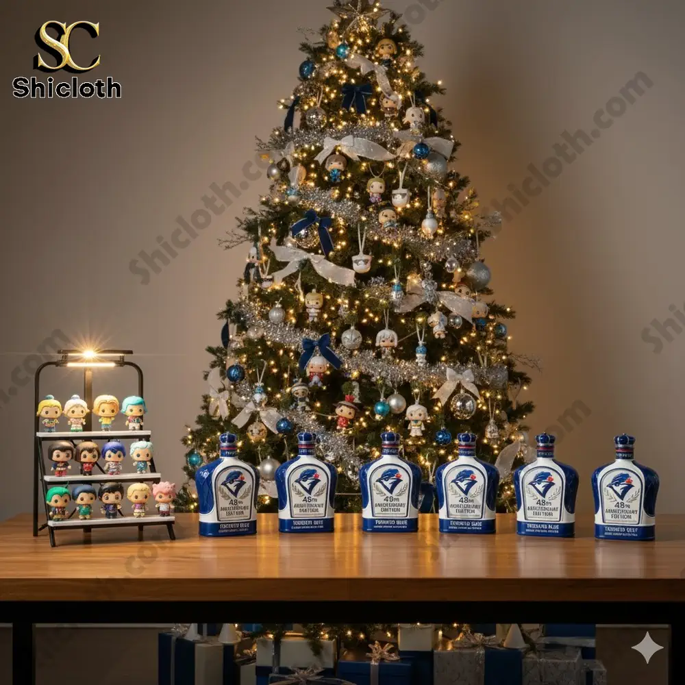 A display of Toronto Blue Jays whiskey bottles and character figures in front of a Christmas tree.