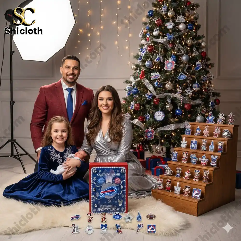 A family poses beside a Christmas tree decorated with Buffalo Bills ornaments and a Mickey Mouse Advent calendar box!