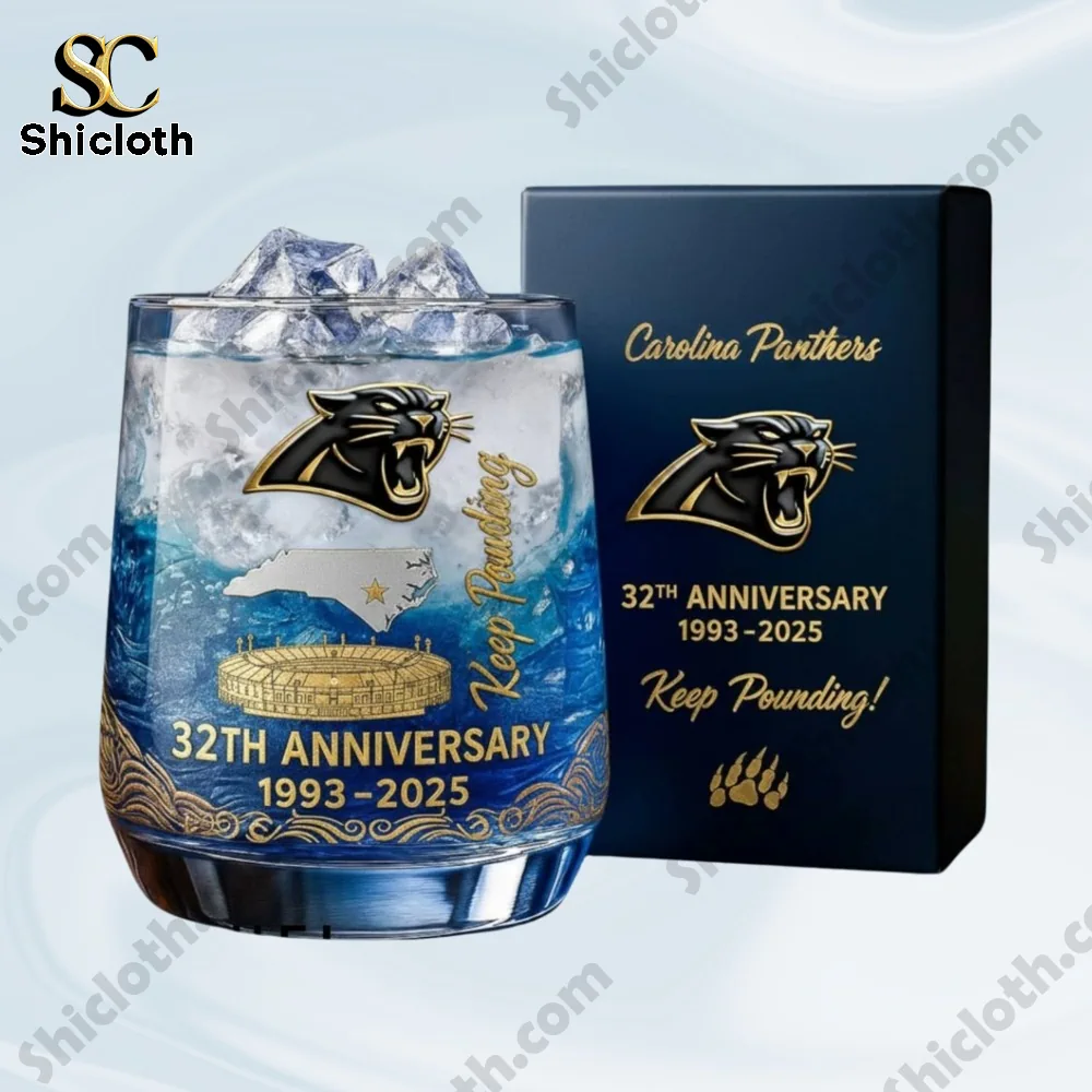 Close up of a Carolina Panthers thirty second anniversary glass with gift box beside it.