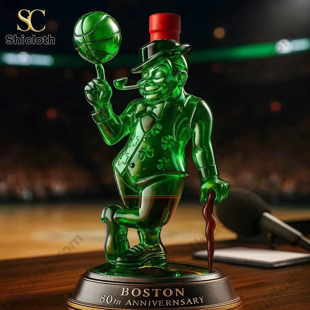 A green mascot statue wearing a red hat displayed courtside.