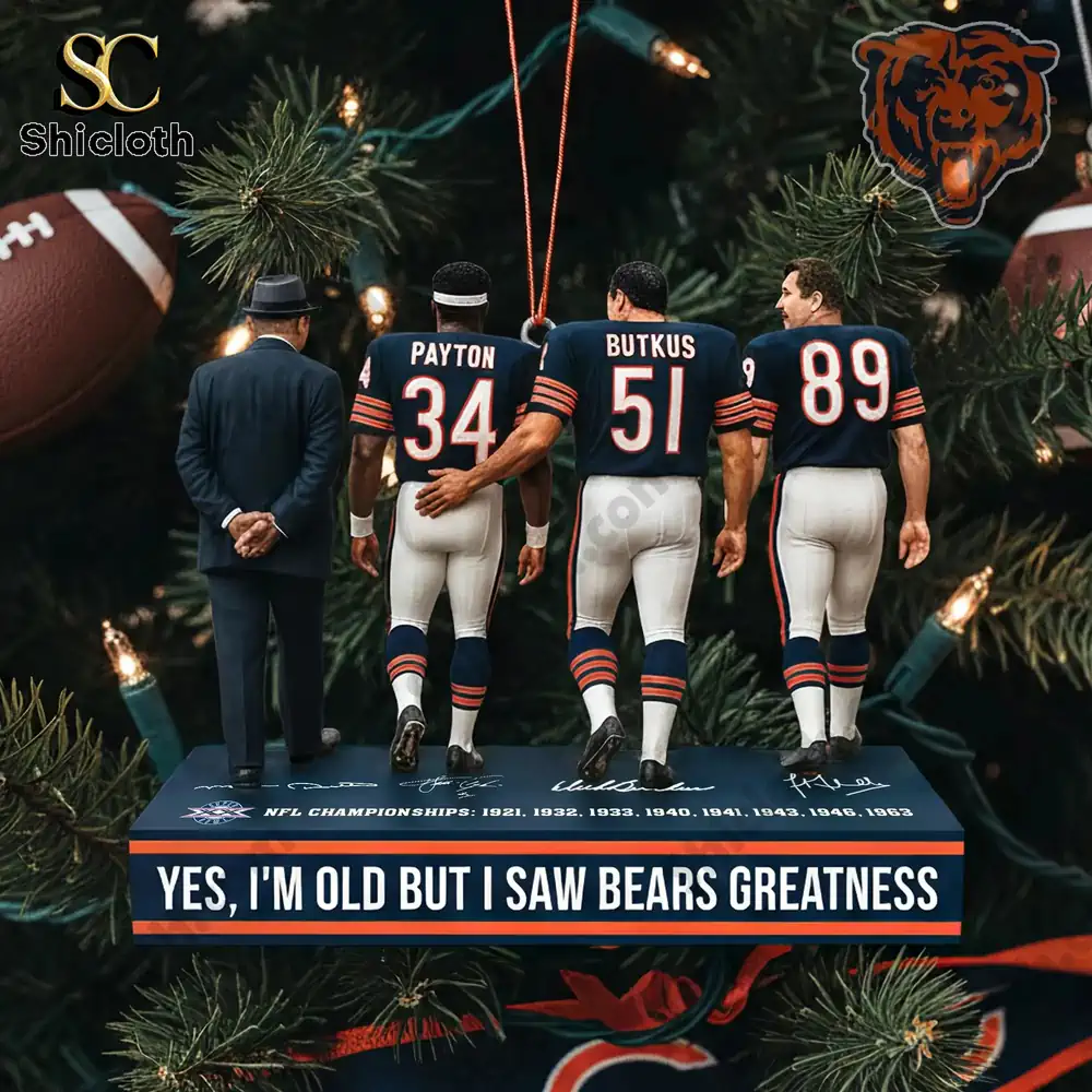 Three Chicago Bears figures standing on a display base with a holiday tree background.