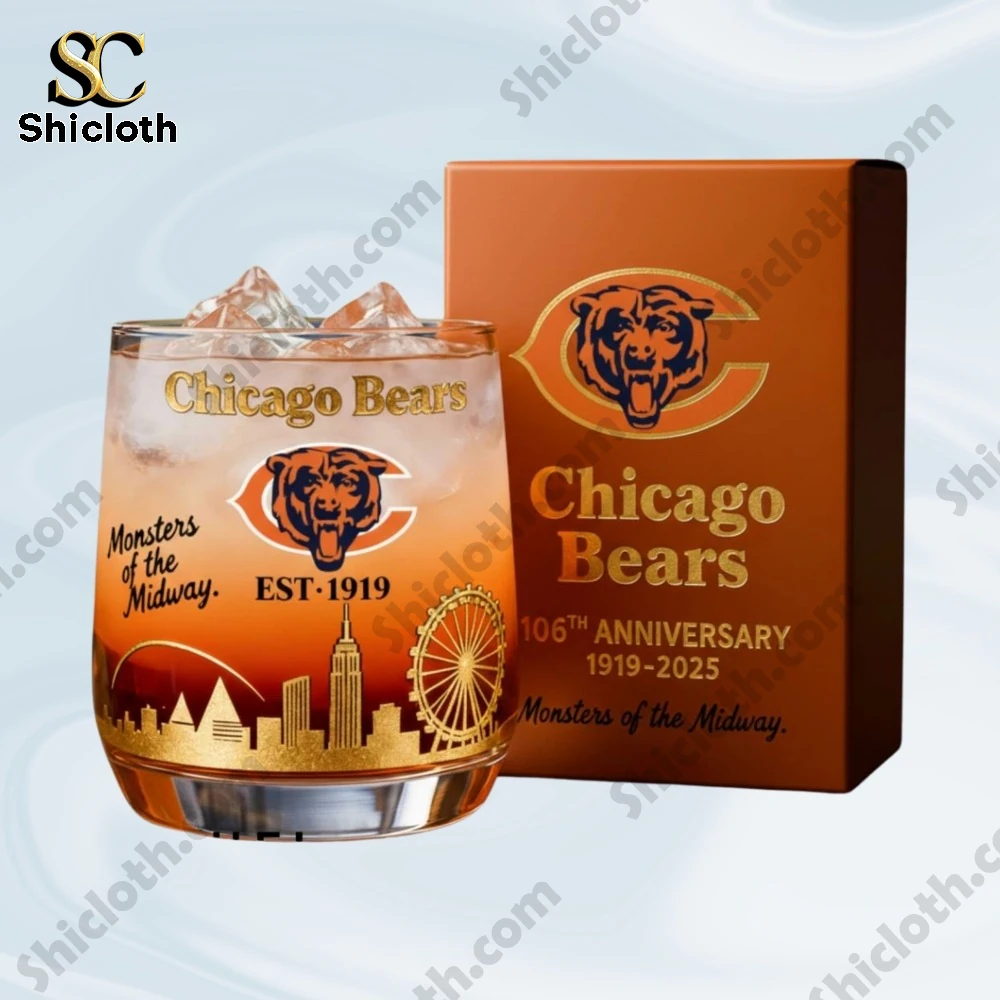 A Chicago Bears anniversary glass with ice placed beside its matching box.