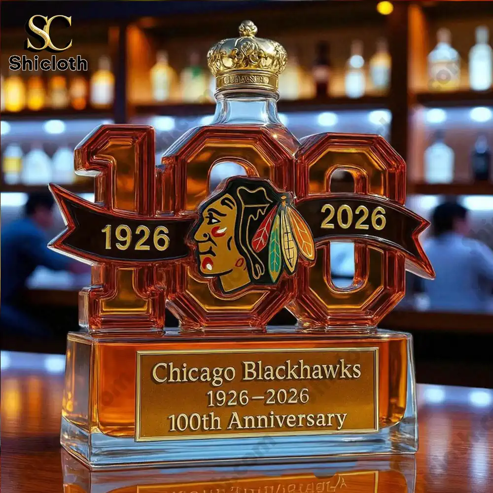 Close up of a Chicago Blackhawks 100th Anniversary whiskey bottle with a crown-shaped cap.