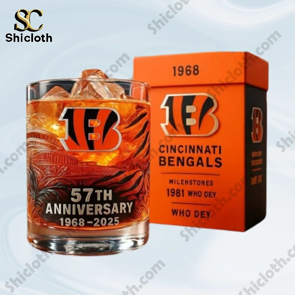 A Bengals themed anniversary glass with ice placed next to an orange gift box.