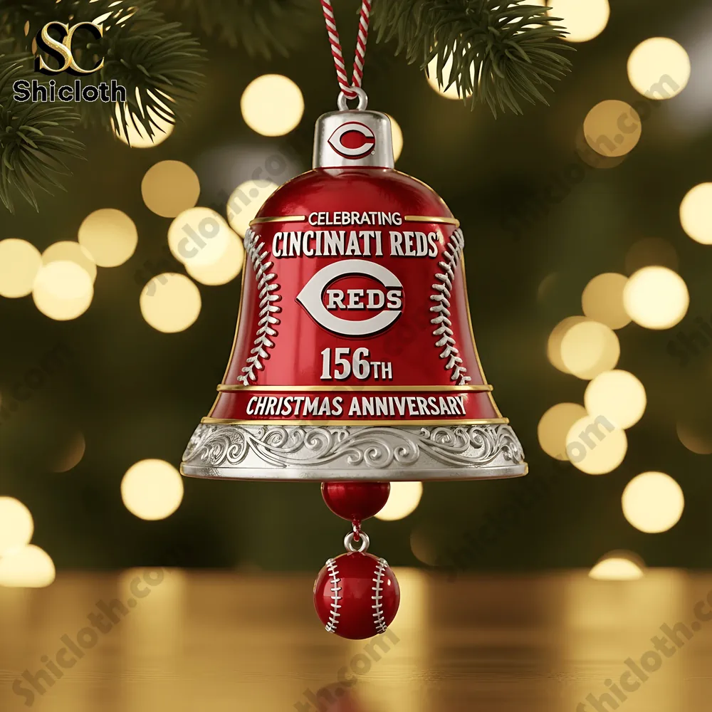 Close up of a Cincinnati Reds 156th anniversary red Christmas bell ornament hanging on a tree.