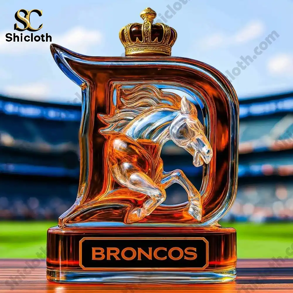 A Broncos D shaped bottle with a crown topper displayed on a football field!