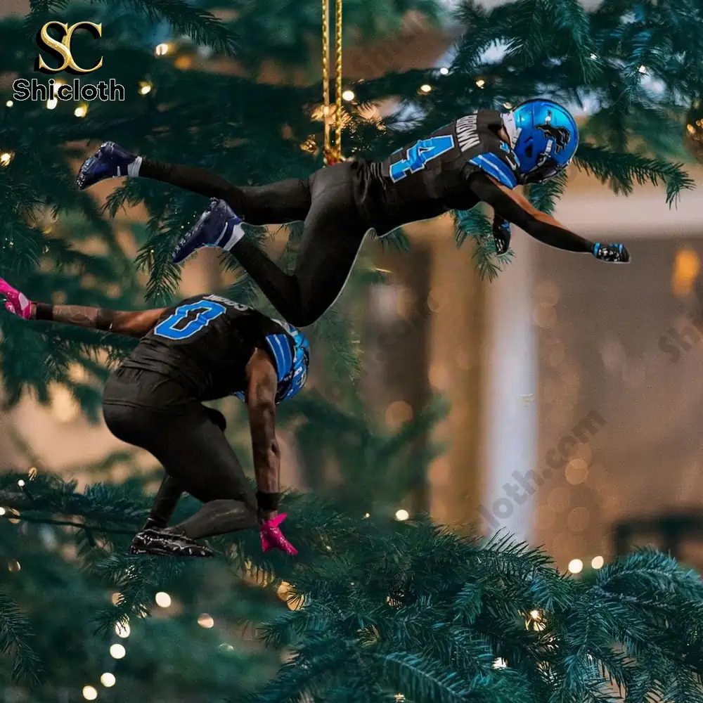 Detroit Lions football player ornaments hanging from a Christmas tree during a touchdown celebration.