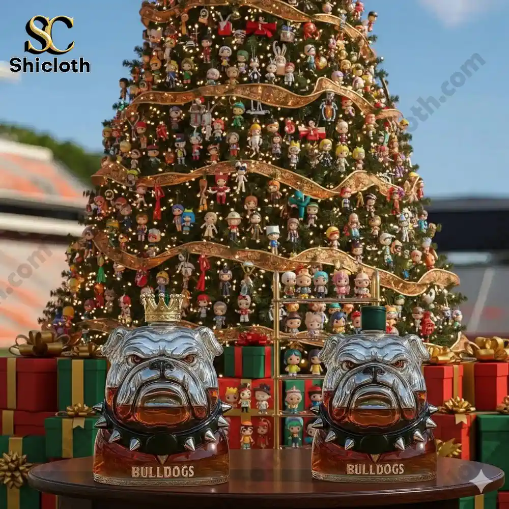 Two bulldog shaped bottles on a table in front of a decorated Christmas tree with many ornaments.