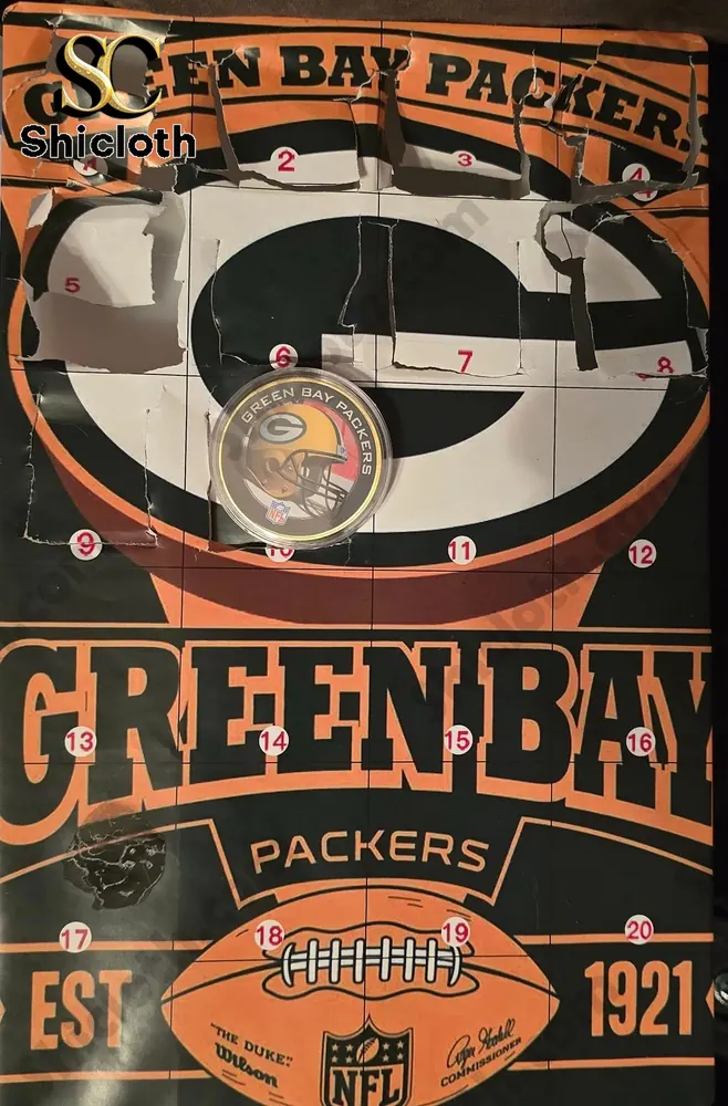 Green Bay Packers Advent Calendar 2025 NFL Countdown Gift Box 4 Partially opened Green Bay Packers Advent Calendar showing one of the small gifts inside.