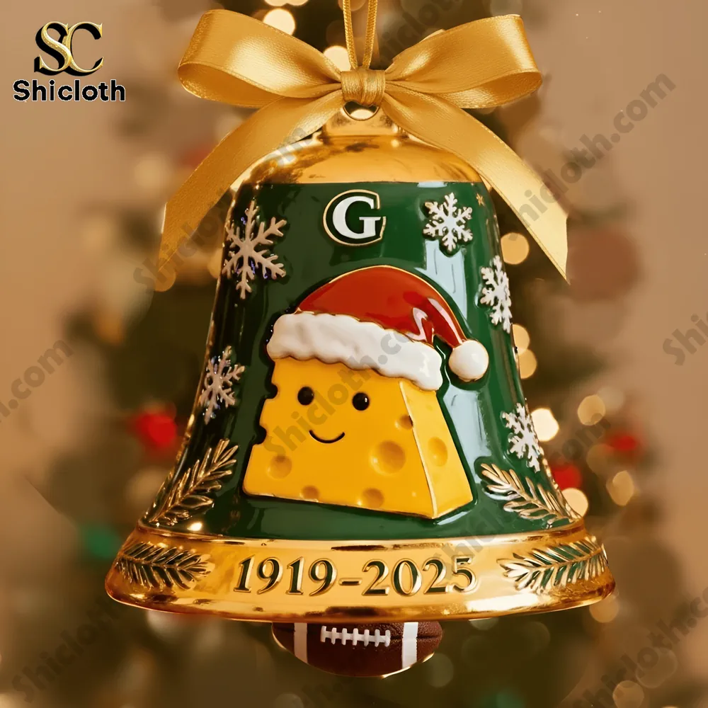 A Green Bay Packers 106th Anniversary Christmas bell ornament with a cheese design and gold ribbon hanging on a tree!