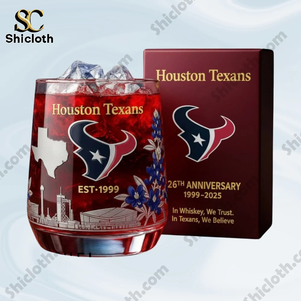 Houston Texans anniversary glass with red drink and gift box behind it.
