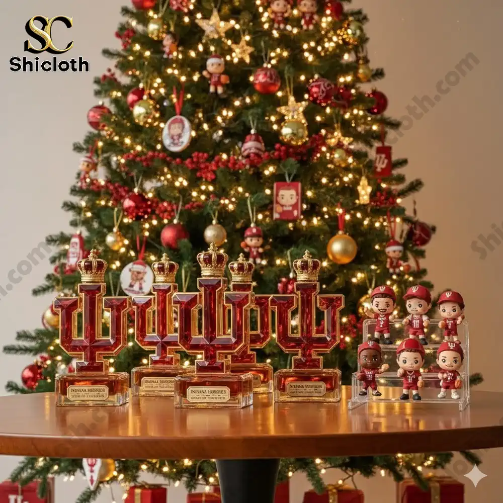 Trophies shaped like the IU logo and small character figures displayed in front of a decorated Christmas tree.