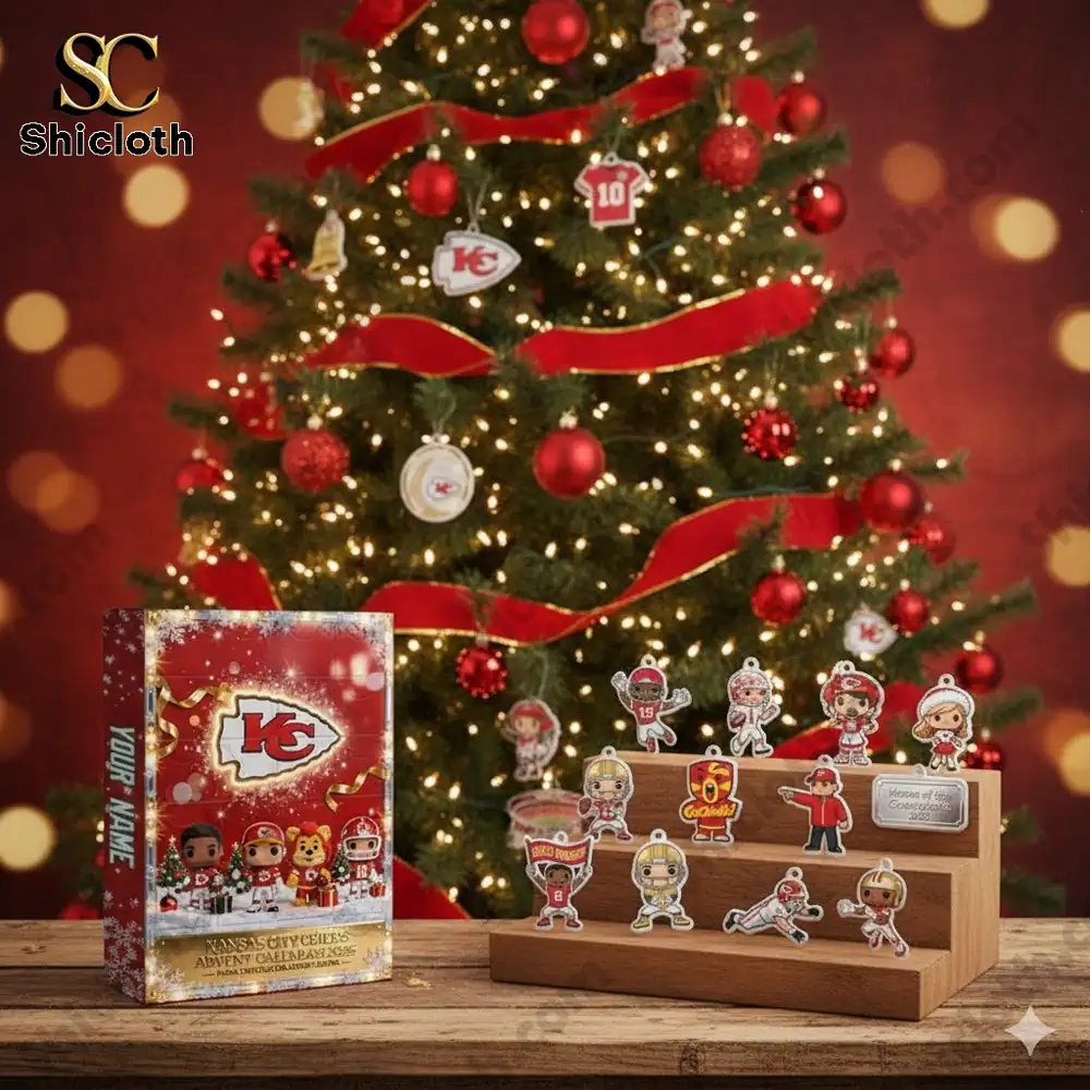 Kansas City Chiefs themed Christmas tree with red ornaments and an advent calendar box on a wooden table!