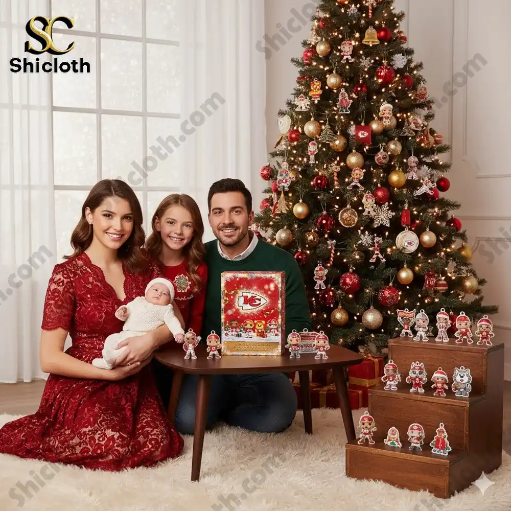 Family posing with Kansas City Chiefs advent calendar and Christmas tree decorated with red and gold ornaments!