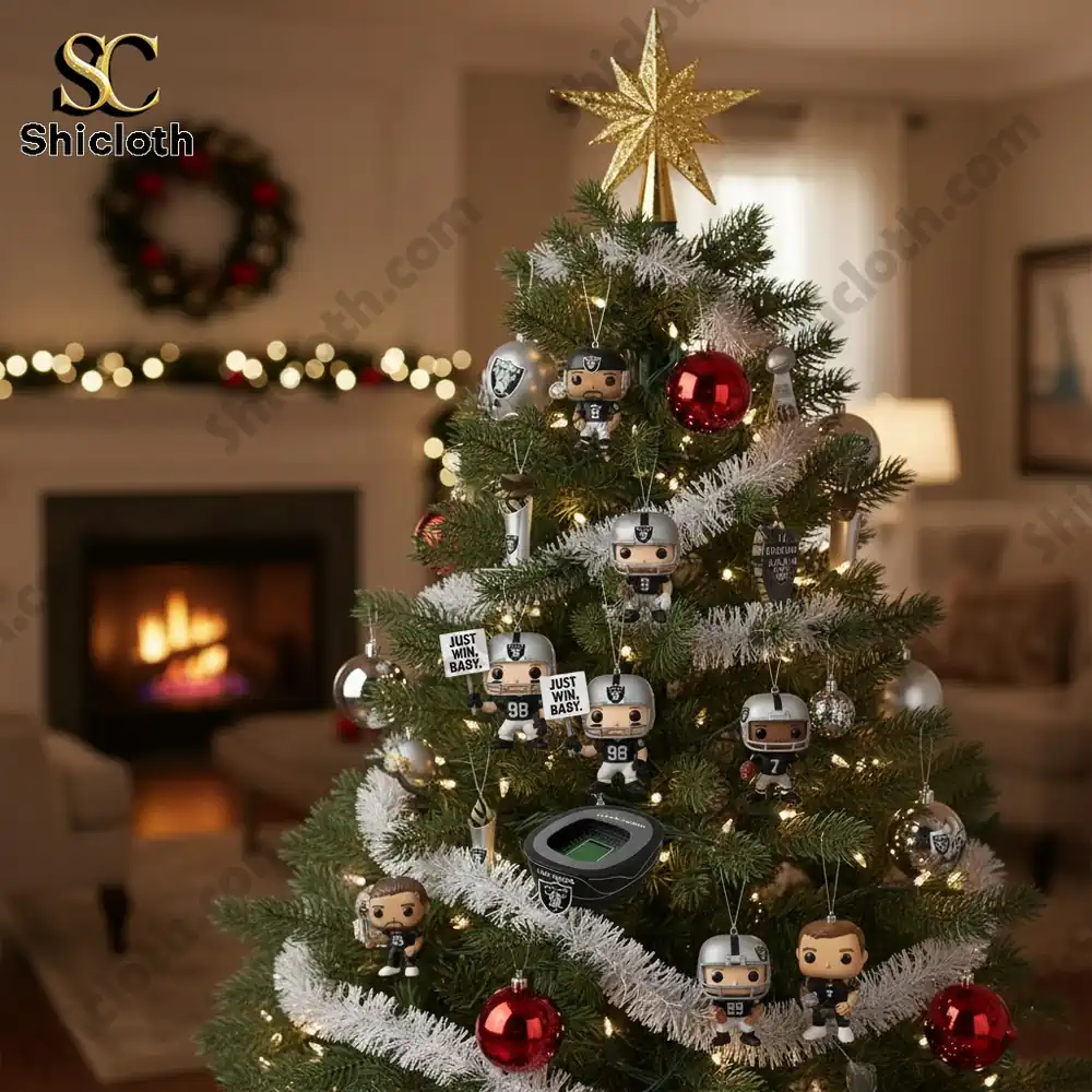 Las Vegas Raiders 65th Anniversary Limited Edition Advent Calendar 2025 3 Christmas tree decorated with Las Vegas Raiders themed ornaments and mini figures near a fireplace.