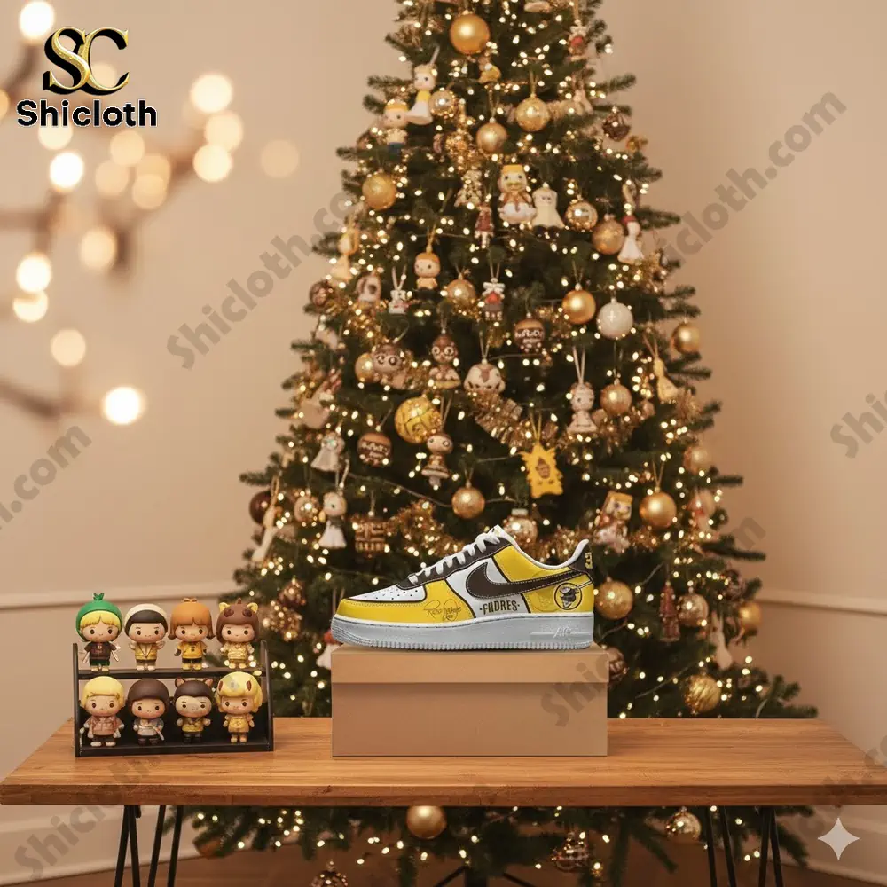 Custom Padres tribute shoes displayed on a table in front of a decorated Christmas tree!