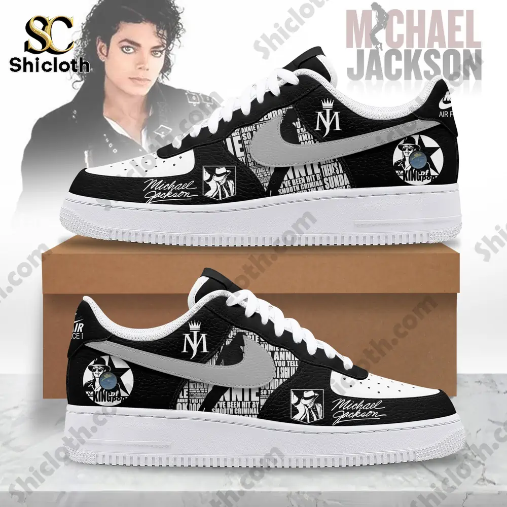 Black and white themed sneakers displayed in front of a box with a photo of a curly haired man in the background!