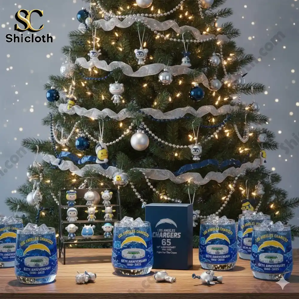 A Christmas tree decorated with chargers themed ornaments and anniversary glasses on a table.