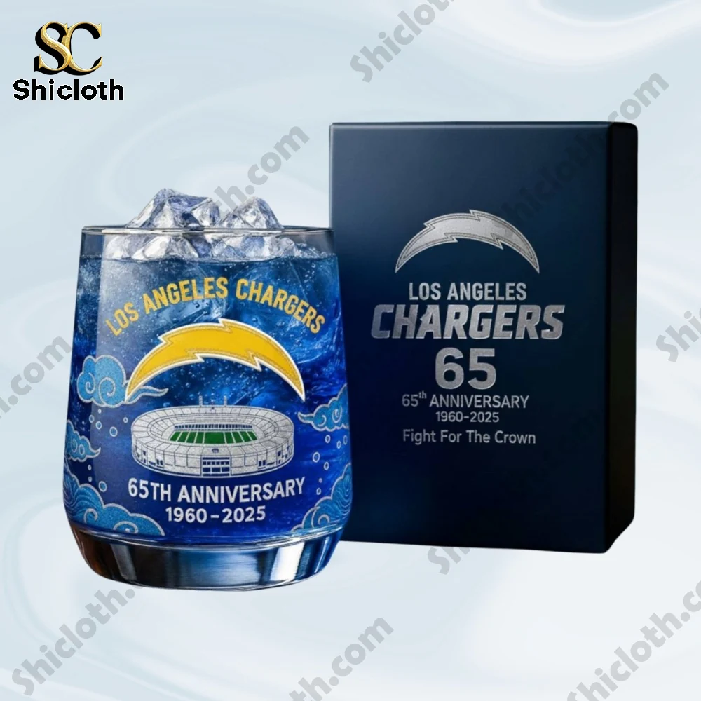 A close view of a chargers anniversary glass beside its presentation box.