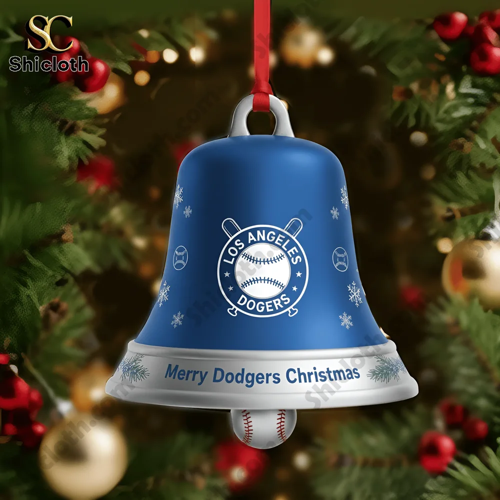 Close up of a Los Angeles Dodgers blue bell ornament with team logo and baseball charm hanging on a tree.