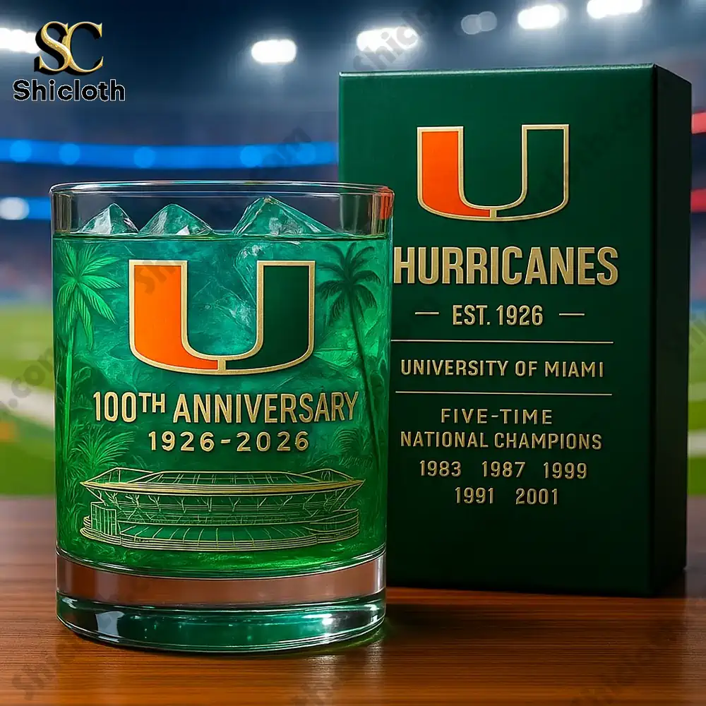 A close up of a Miami Hurricanes one hundredth anniversary glass with its green box beside it.