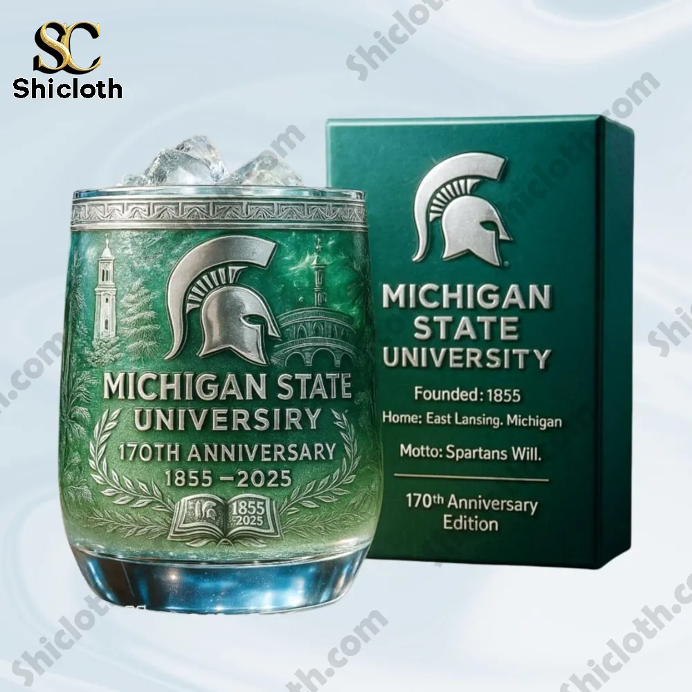 Close up of a Michigan State University seventieth anniversary green glass and its box.
