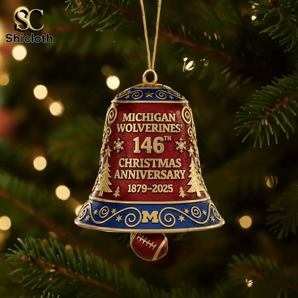 Close up of Michigan Wolverines 146th anniversary Christmas bell ornament hanging on a decorated tree!
