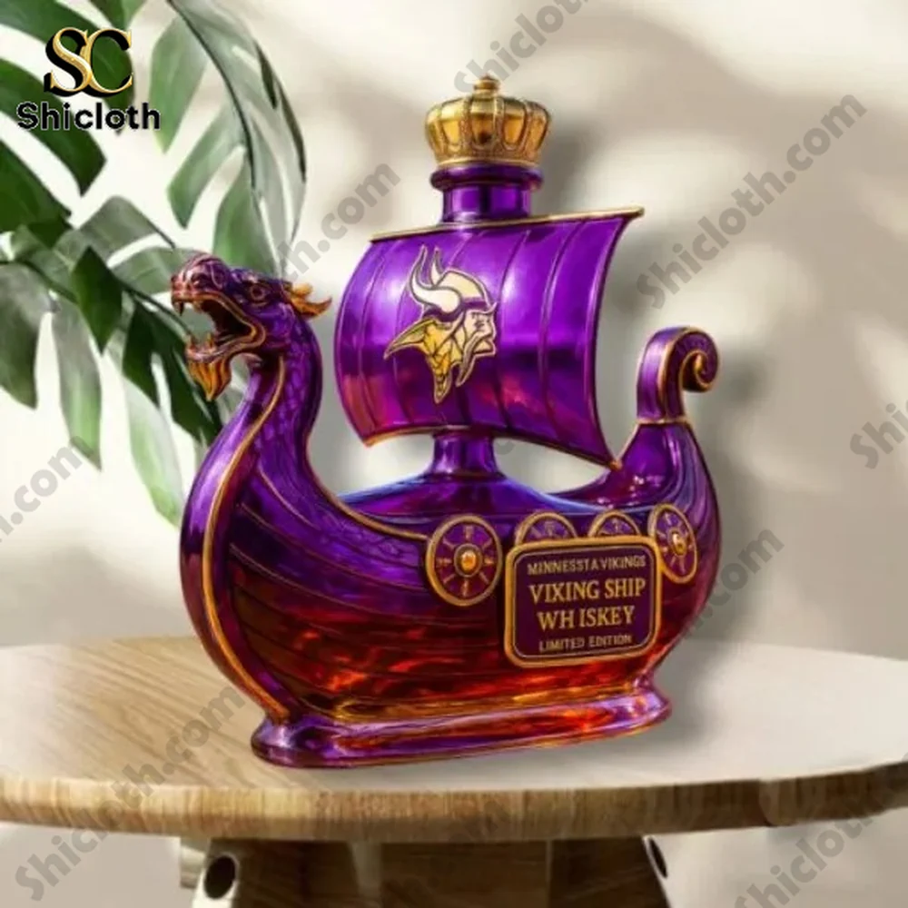 Purple viking ship whiskey bottle with a gold top on a table.