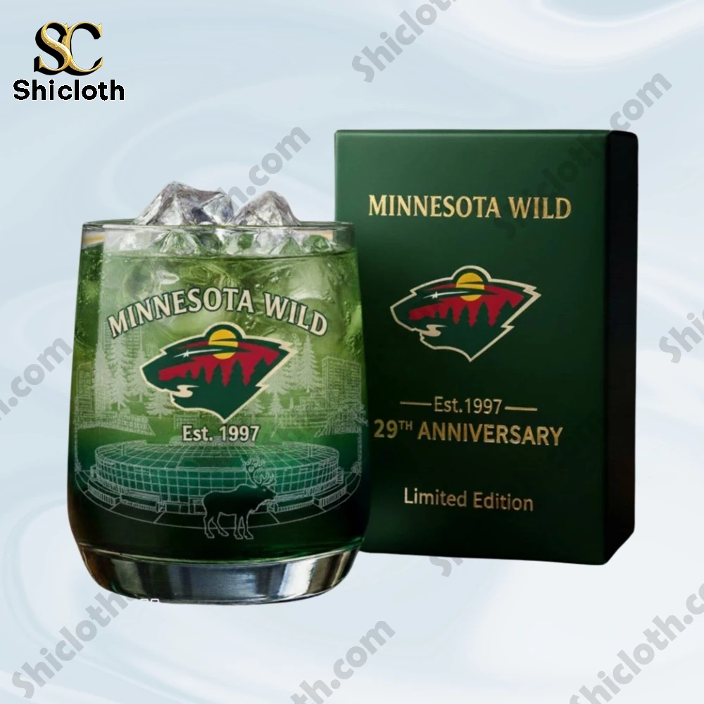 A green Minnesota Wild anniversary glass with ice displayed beside its limited edition box.