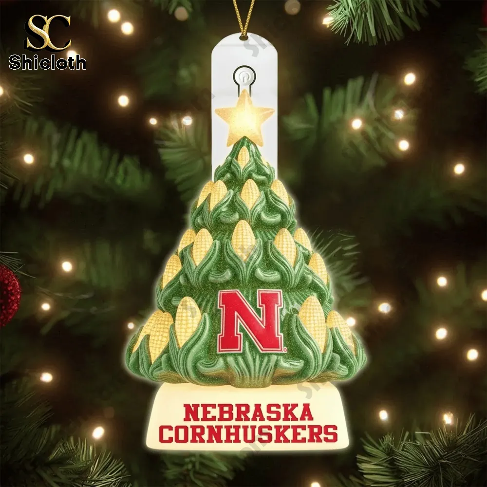 A Nebraska themed corn tree ornament hanging on a Christmas tree.