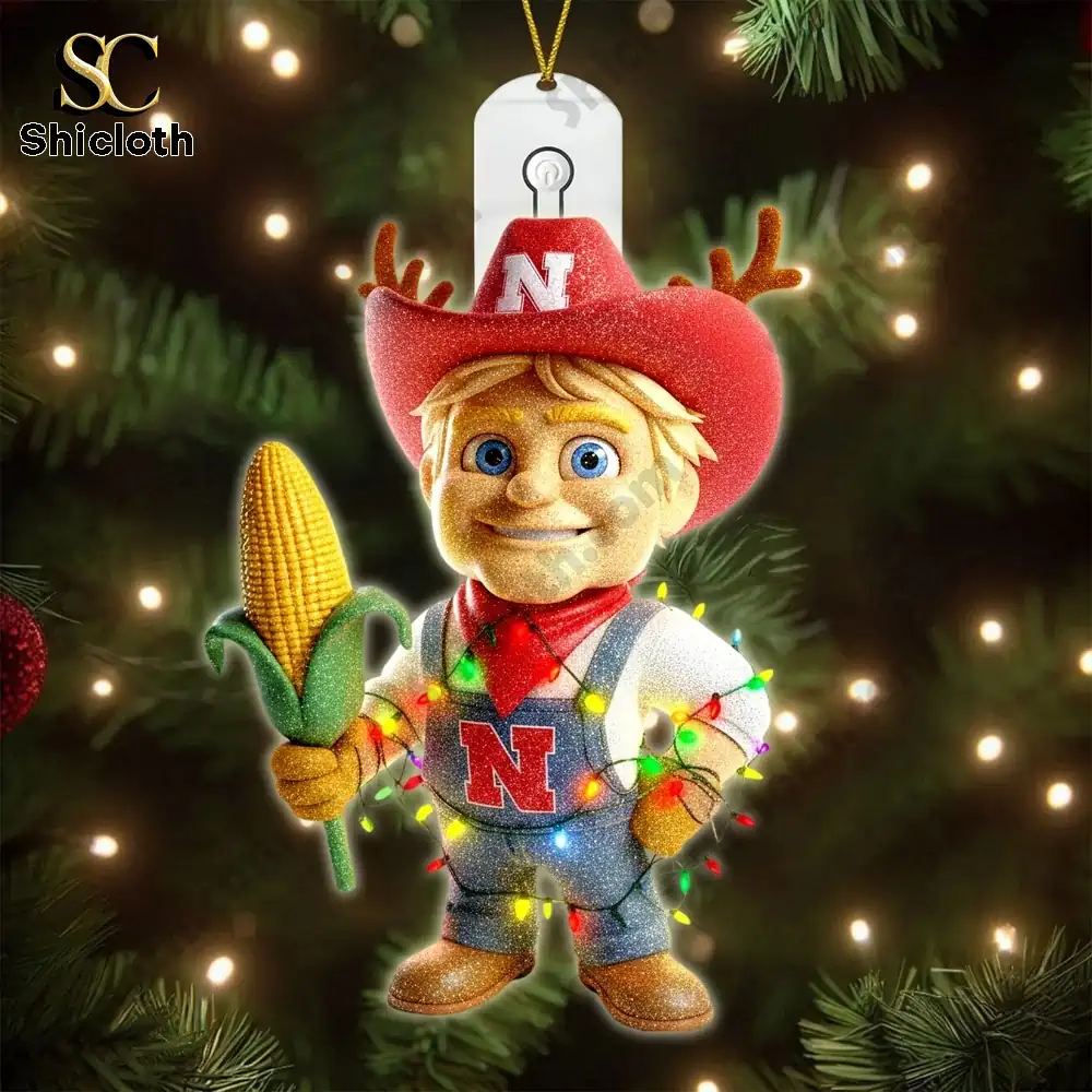 Nebraska Cornhuskers 2025 Christmas Tree Topper And Ornament Set 4 A smiling farm boy ornament in Nebraska colors holding corn.