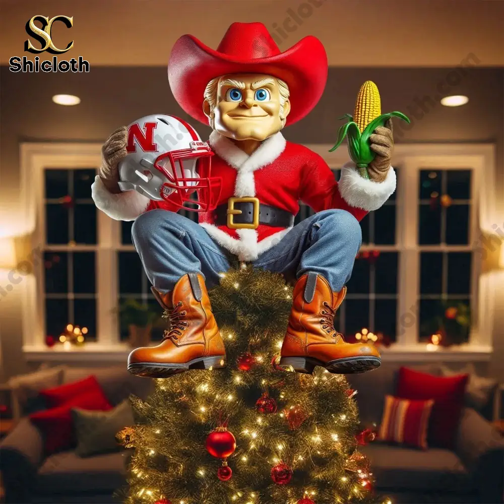 Nebraska Cornhuskers 2025 Christmas Tree Topper And Ornament Set 8 A Nebraska cowboy figure tree topper sitting on a decorated Christmas tree.