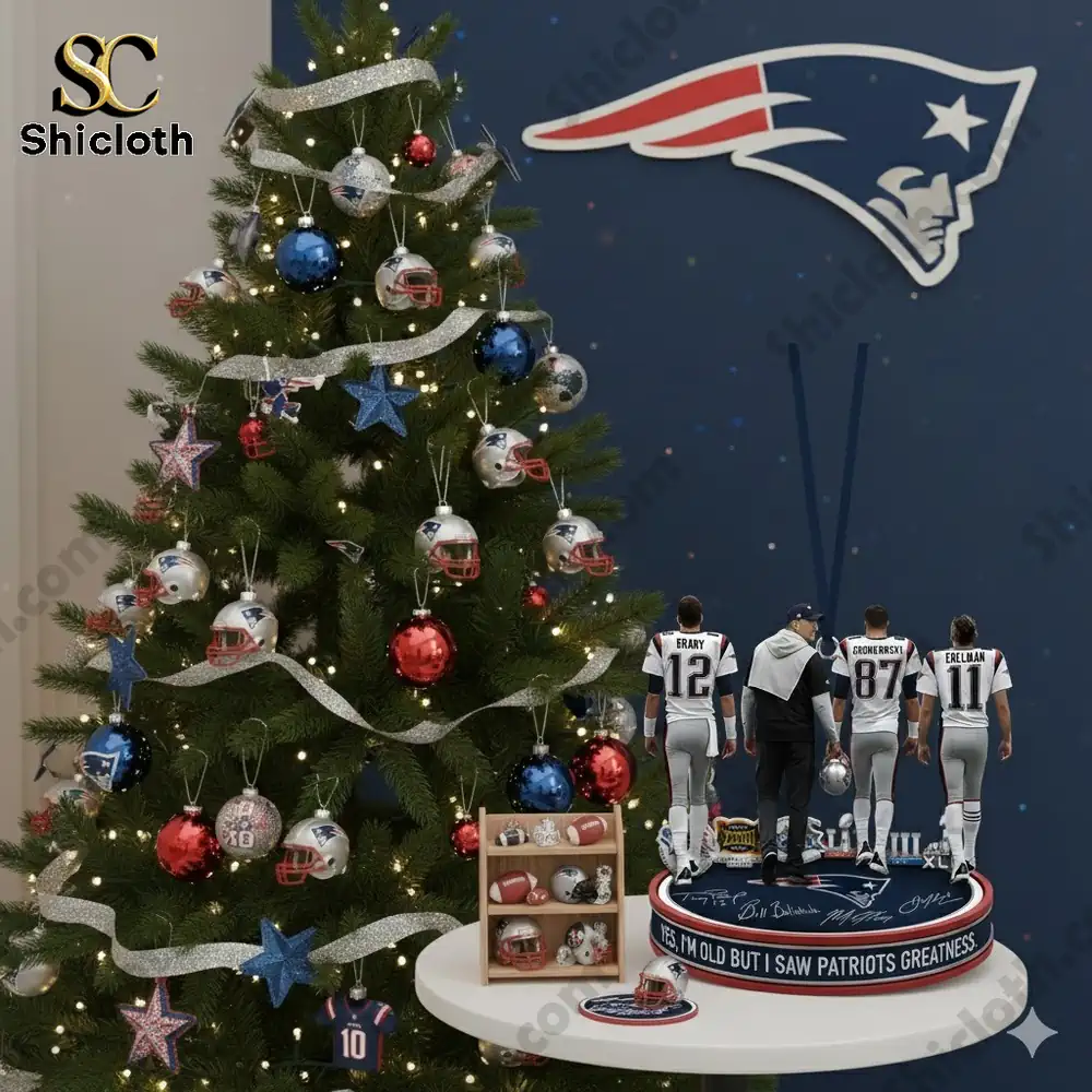 A Christmas tree decorated with Patriots themed ornaments beside a table displaying a Patriots figure set!