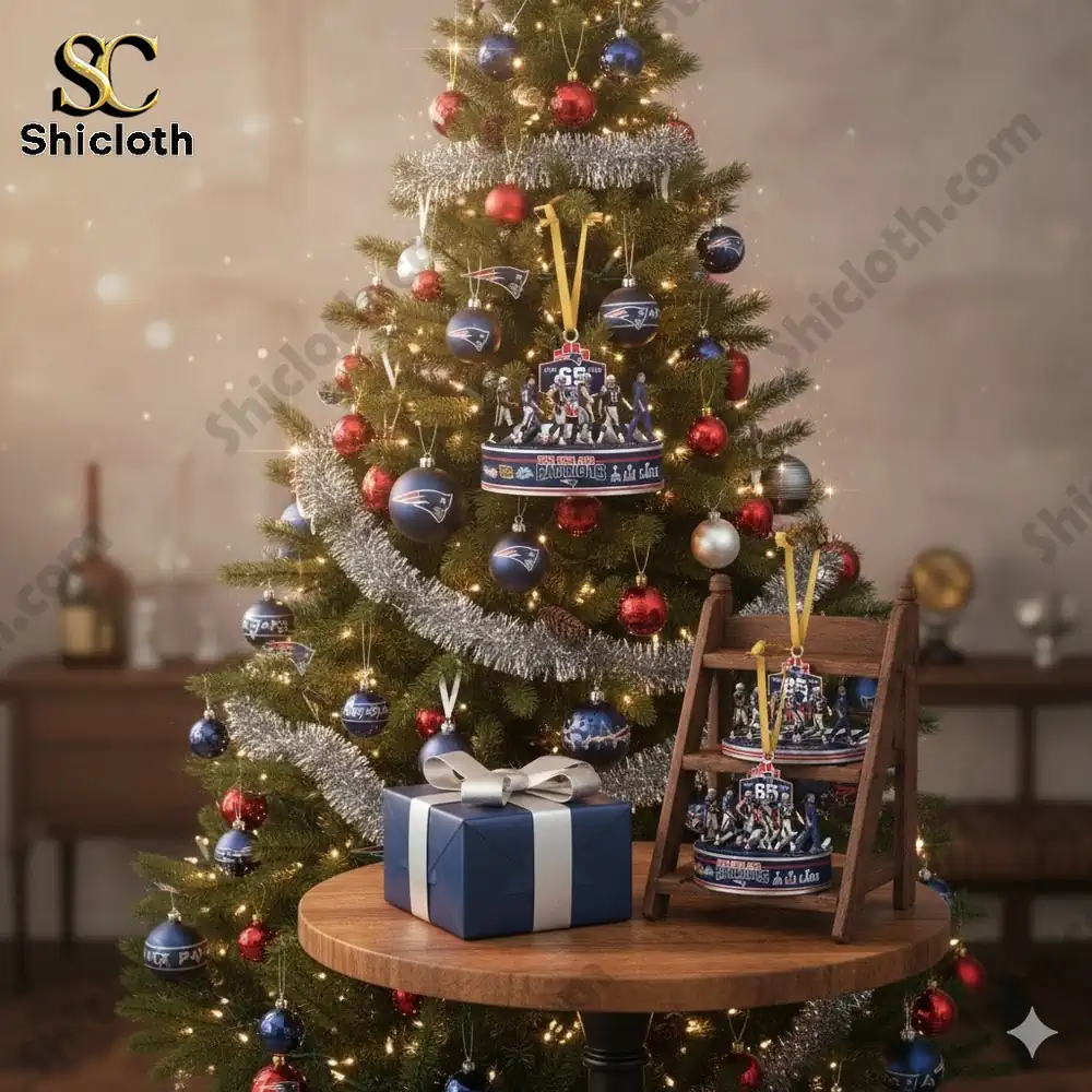 Christmas tree decorated with New England Patriots ornaments and a gift box under the tree.