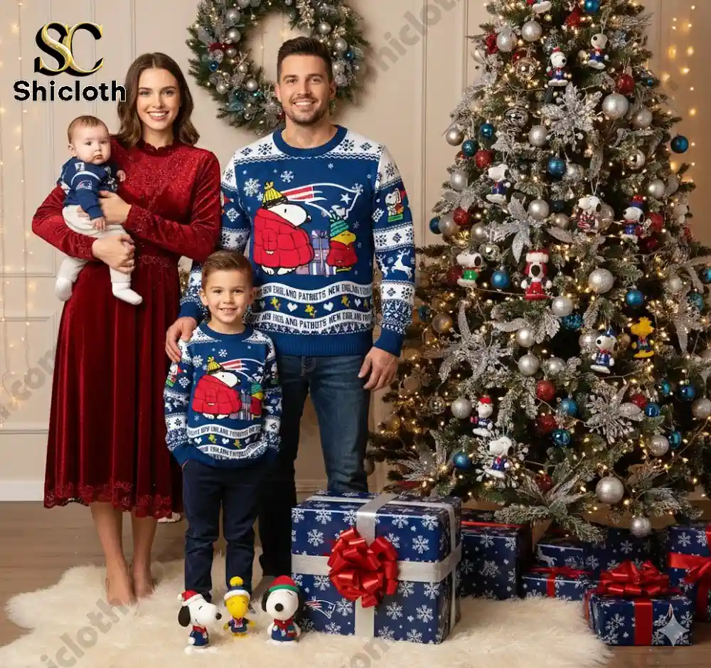 Family in New England Patriots-themed Christmas sweaters in front of a decorated tree with Snoopy and friends.