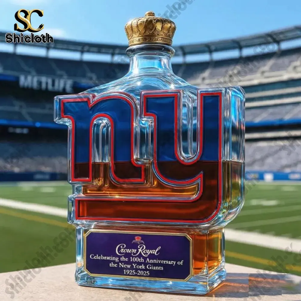 A New York Giants logo bottle with a gold crown style cap on a football field!