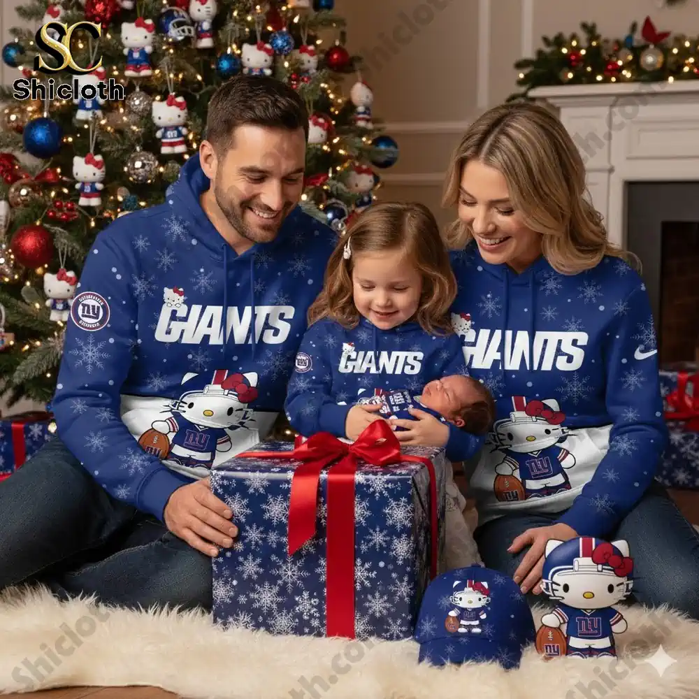 New York Giants Hello Kitty Limited Hoodie Shirt 3 A family of four dressed in matching New York Giants Hello Kitty-themed hoodies with a newborn in festive holiday surroundings.