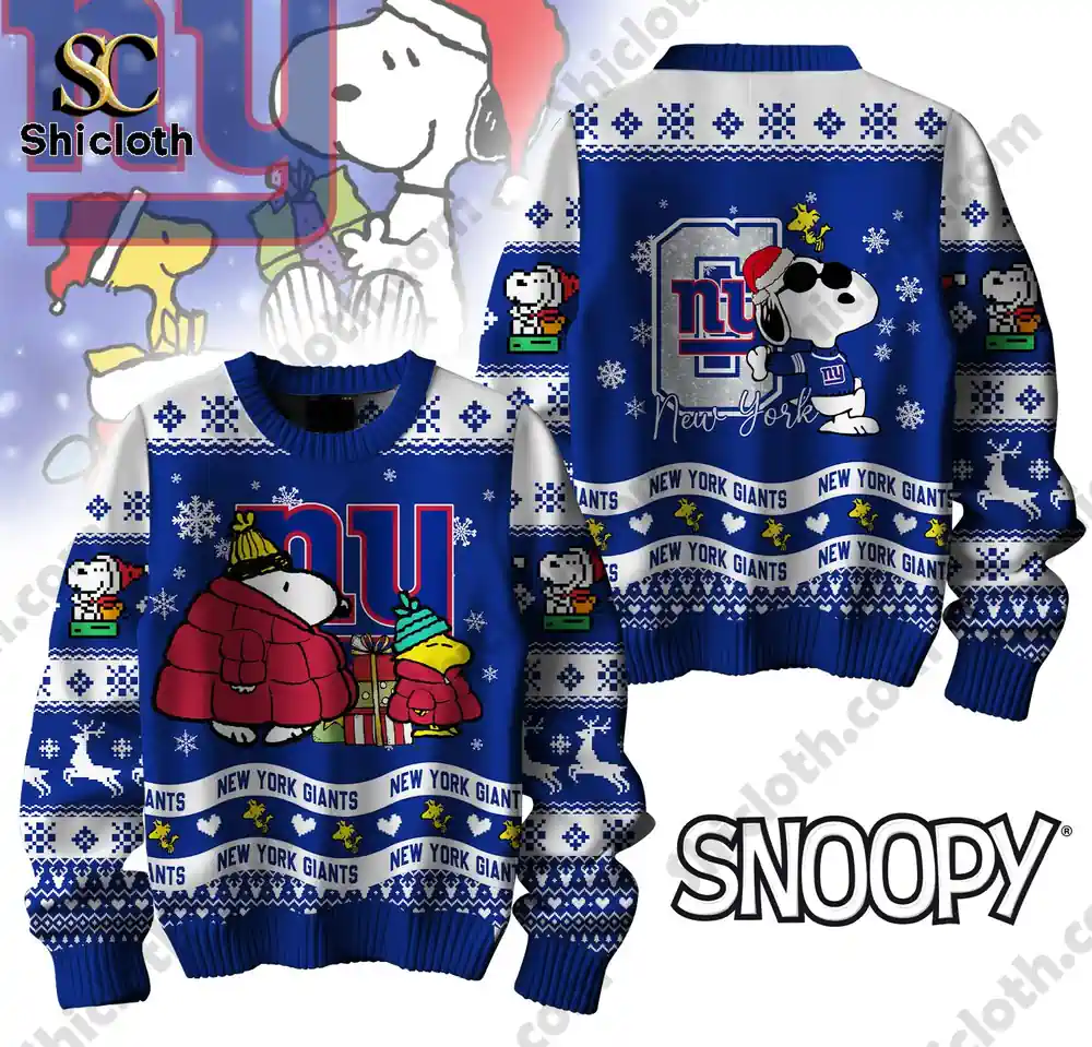 A close-up of a blue New York Giants-themed sweater with Snoopy and friends, featuring Christmas elements and NFL branding.