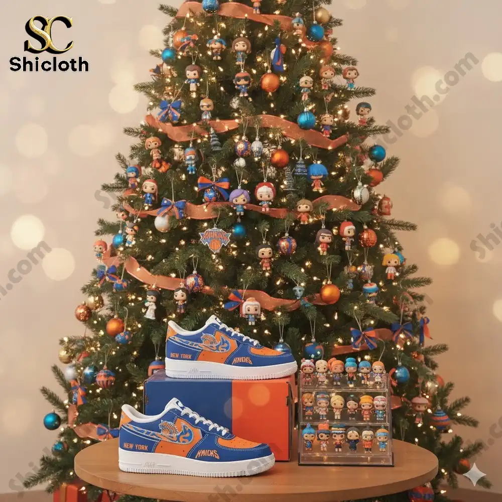 A Christmas tree decorated with Knicks themed colors and small collectible figures with Knicks themed shoes displayed in front of it!