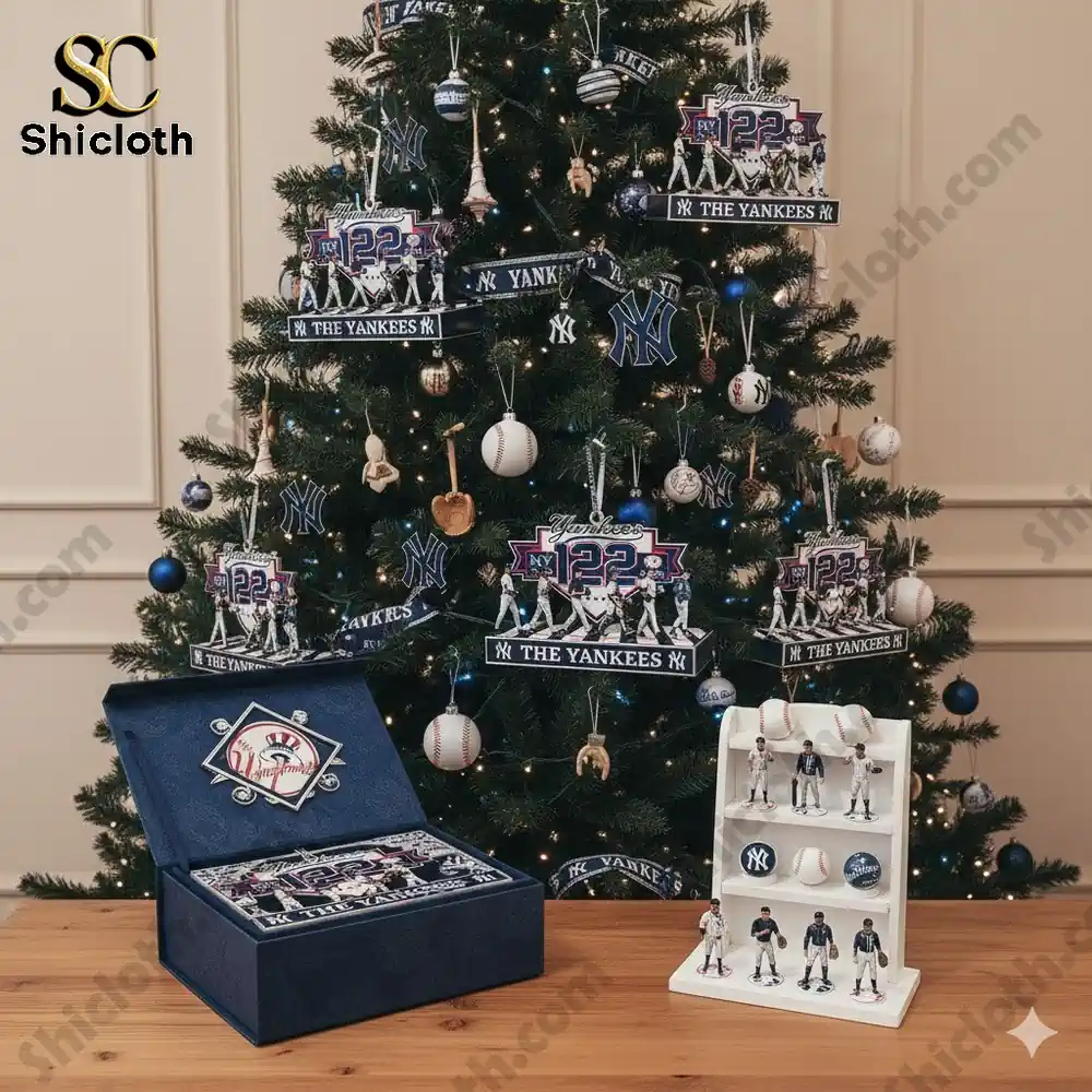 A decorated Christmas tree with New York Yankees-themed ornaments and figurines displayed underneath.