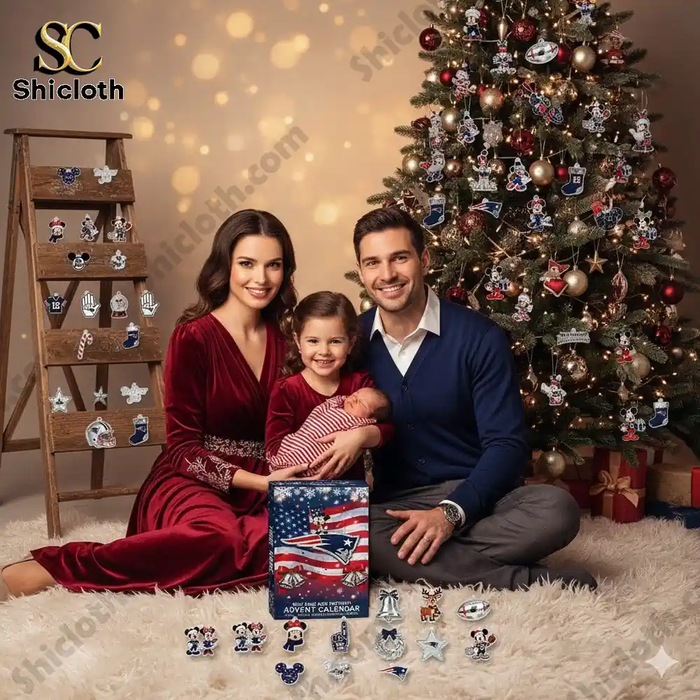 A smiling family sitting beside a Christmas tree decorated with New England Patriots ornaments and the 2025 Advent Calendar box.
