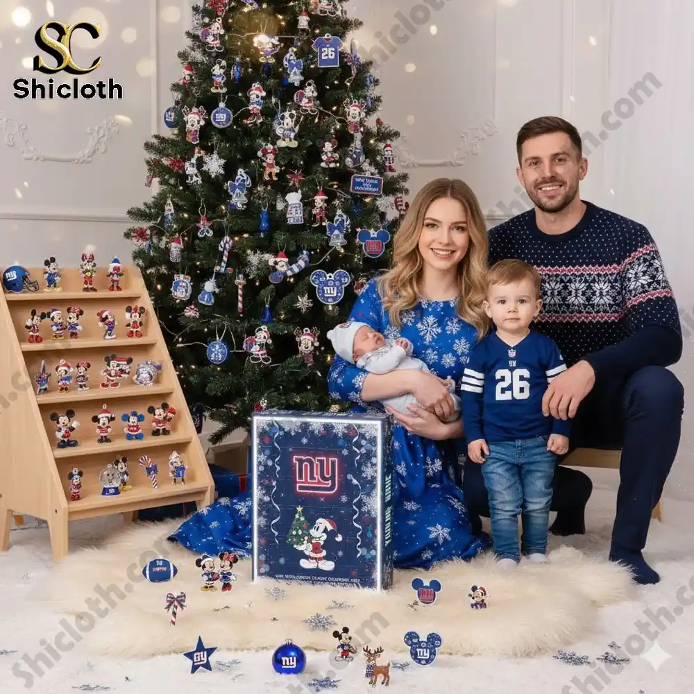 A family sitting by a Christmas tree decorated with New York Giants ornaments and a Shicloth Advent Calendar box in front.