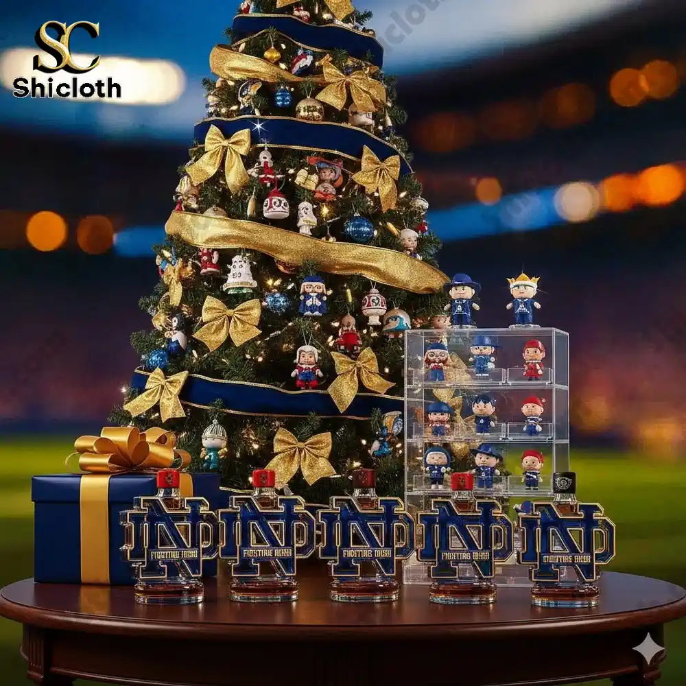 Christmas tree with themed ornaments and Notre Dame shaped bottles on a table!