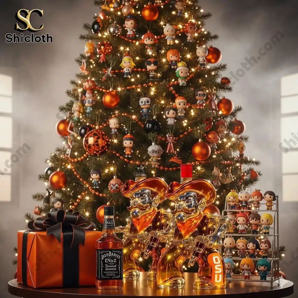 A decorated Christmas tree with small character ornaments and an orange cowboy shaped OSU themed whiskey bottle on a table.