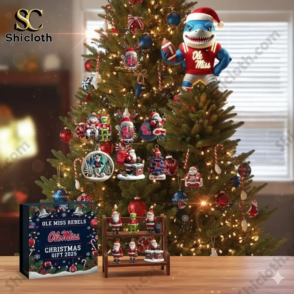 A Christmas tree decorated with Ole Miss themed ornaments and a shark mascot tree topper!