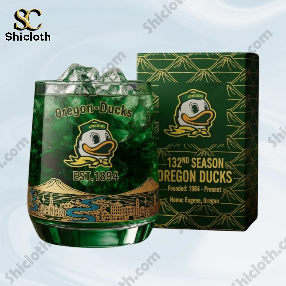 Green Oregon Ducks glass with matching box shown against a light background.