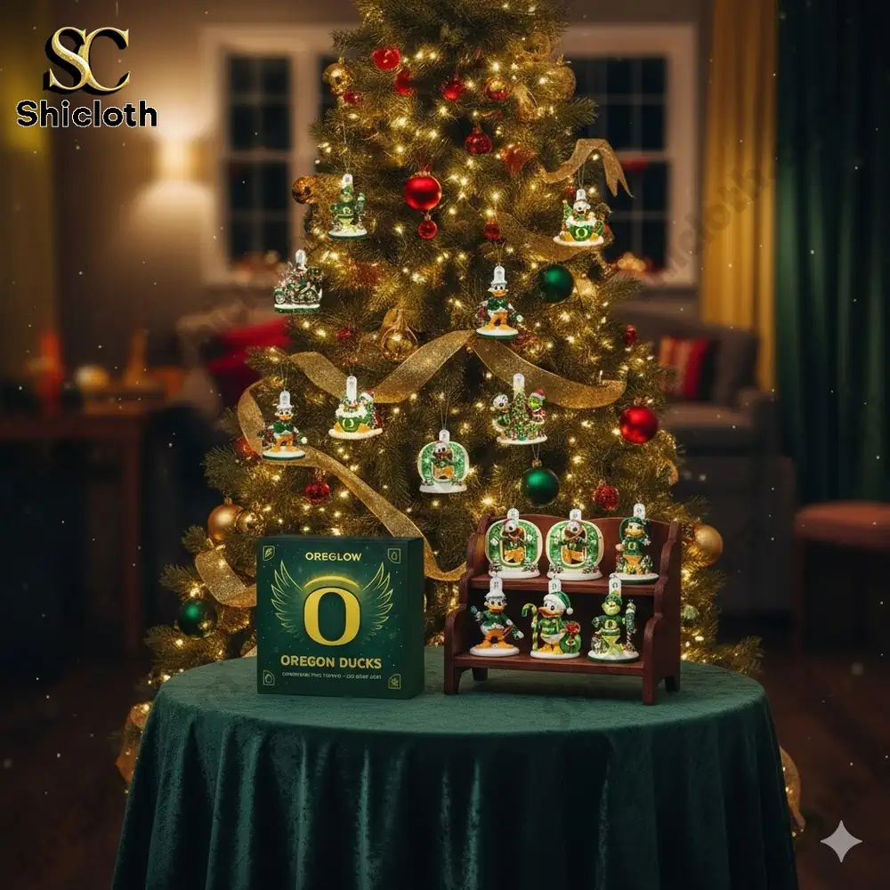 Christmas tree decorated with Oregon Ducks themed ornaments displayed in a cozy living room.