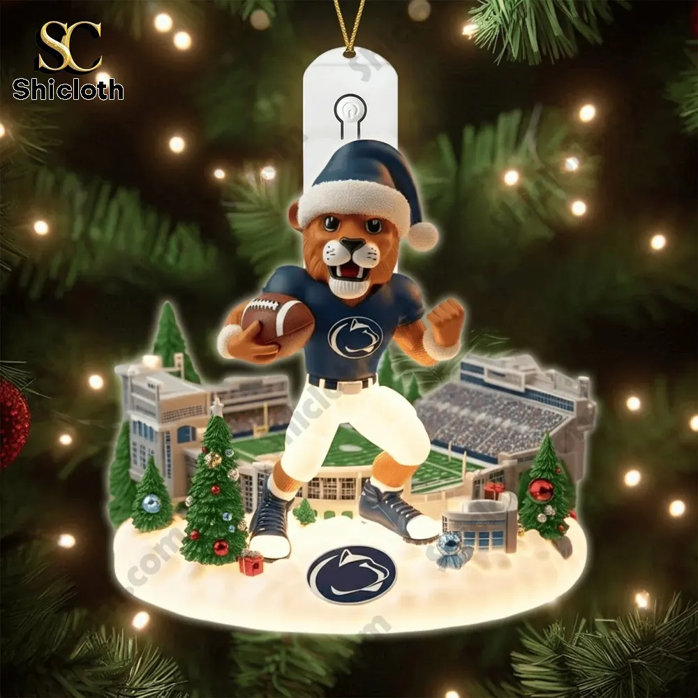 Penn State mascot in holiday outfit with lit tree backdrop