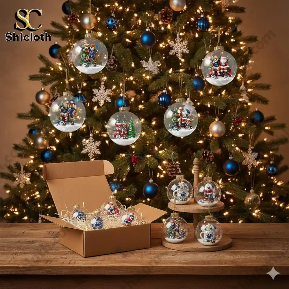 Christmas ornaments featuring Penn State themed figures displayed on a tree and table.