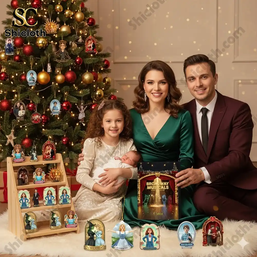 Family portrait with Broadway Musicals advent calendar and stage themed ornaments by the Christmas tree.